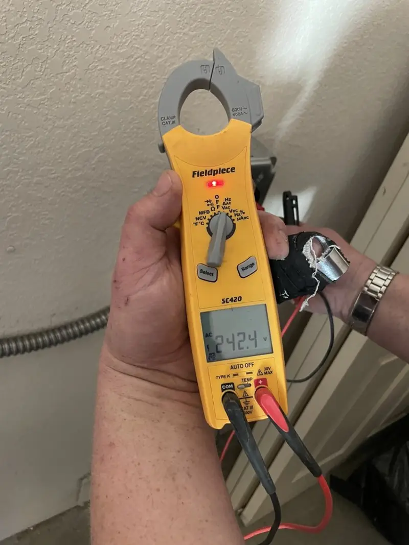 Voltage testing with clamp meter during Electrical Installation Services in Silver Springs Shores